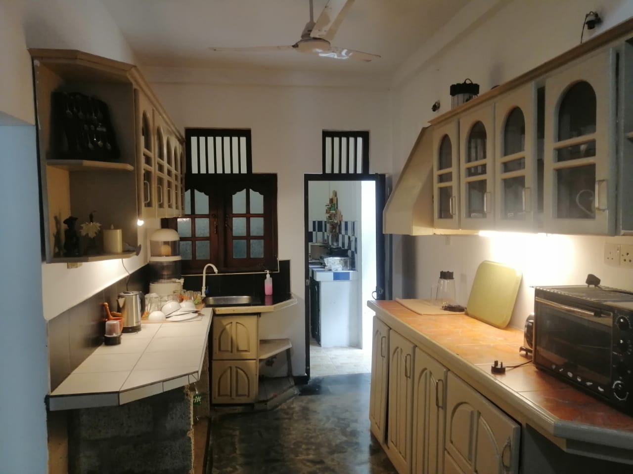 Kitchen with counters, cabinets, sink, and small appliances
